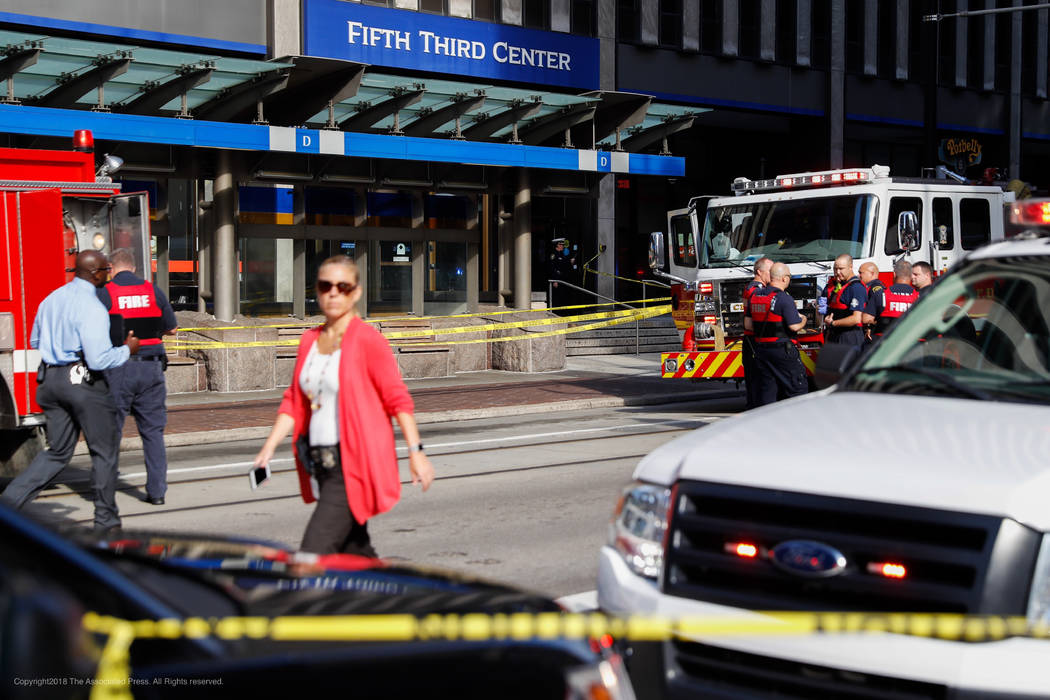 Emergency personnel and police respond to a reported active shooter situation near Fountain Square, Thursday, Sept. 6, 2018, in Cincinnati. (John Minchillo/AP)