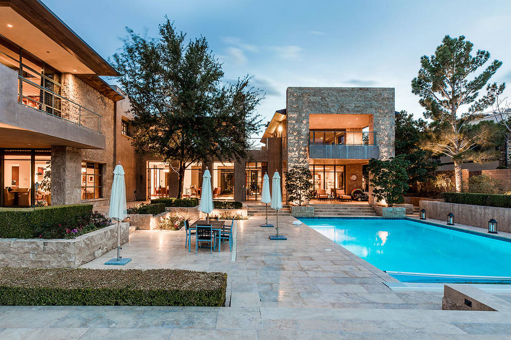 Elements of midcentury modern are integrated into the overall design, including a centralized exterior courtyard surrounded by the main living areas. (Ivan Sher Group)