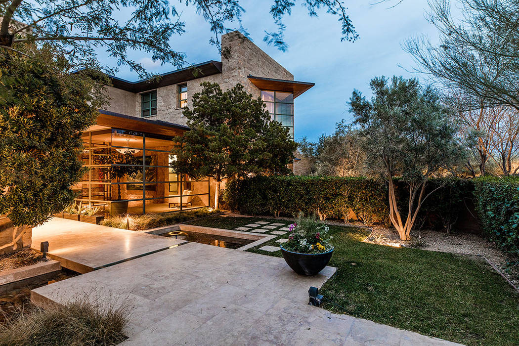 The home has a lot of floor-to-ceiling windows that showcase the backyard and courtyard. (Ivan Sher Group)