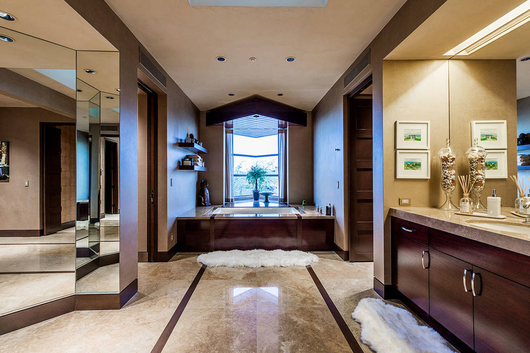 The master bath separates into two private dressing areas. (Ivan Sher Group)