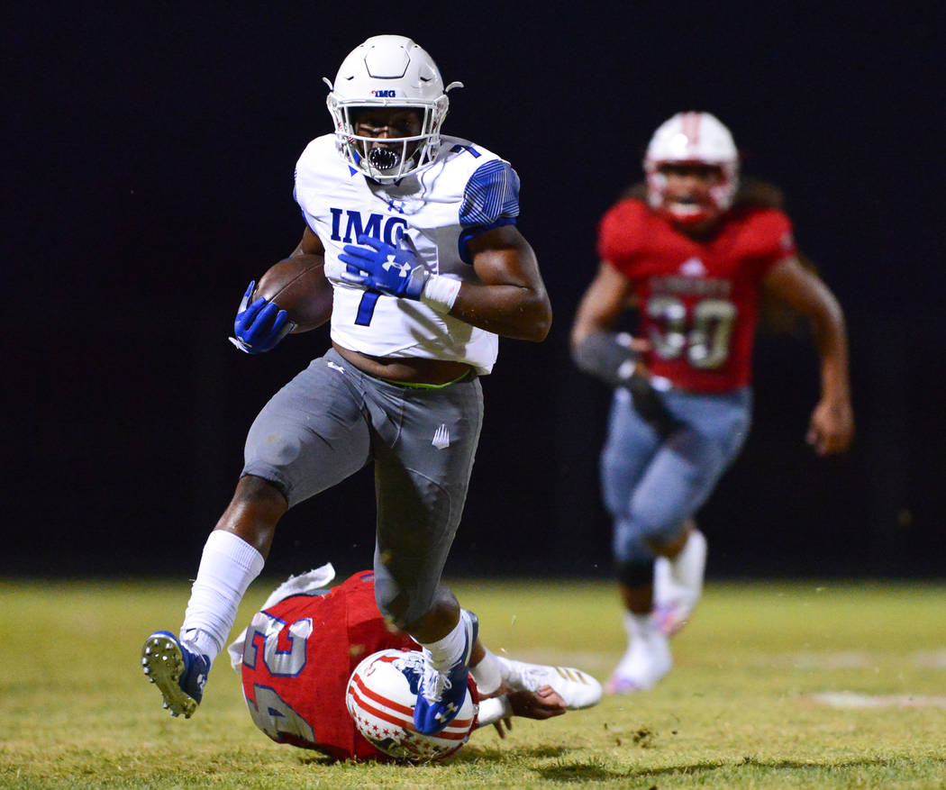 IMG Academy running back Noah Cain (7) carries the ball during a game against Liberty High School at Liberty High School in Henderson on Friday, Sept. 7, 2018. IMG Academy leads at halftime 21-0. ...