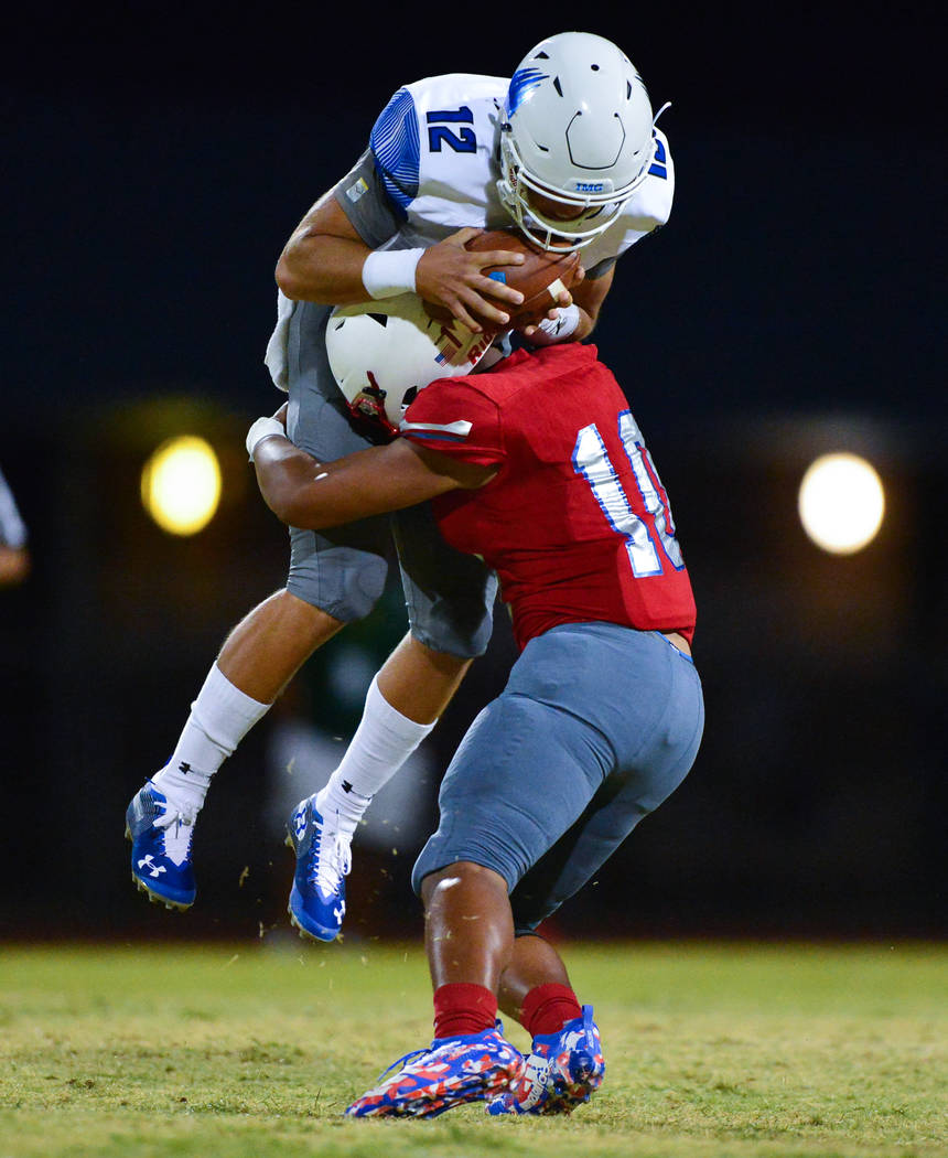 Liberty's Austin Fiaseu (10) tackles IMG Academy quarterback Bryson Lucero (12) at Liberty High School in Henderson on Friday, Sept. 7, 2018. IMG Academy leads at halftime 21-0. Brett Le Blanc Las ...