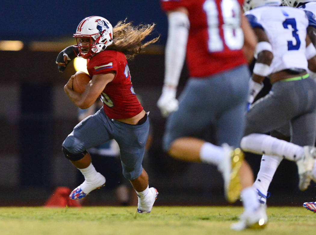Liberty's Zyrus Fiaseu (30) carries the ball during a game against IMG Academy at Liberty High School in Henderson on Friday, Sept. 7, 2018. IMG Academy won 35-0. Brett Le Blanc Las Vegas Review-J ...