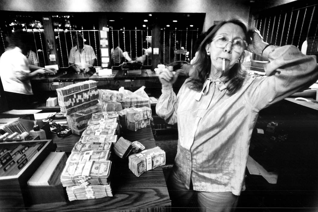 Teddy Jane Binion, wife of Benny Binion, counts $4 million before the start of a poker tournament in 1985. (File Photo)