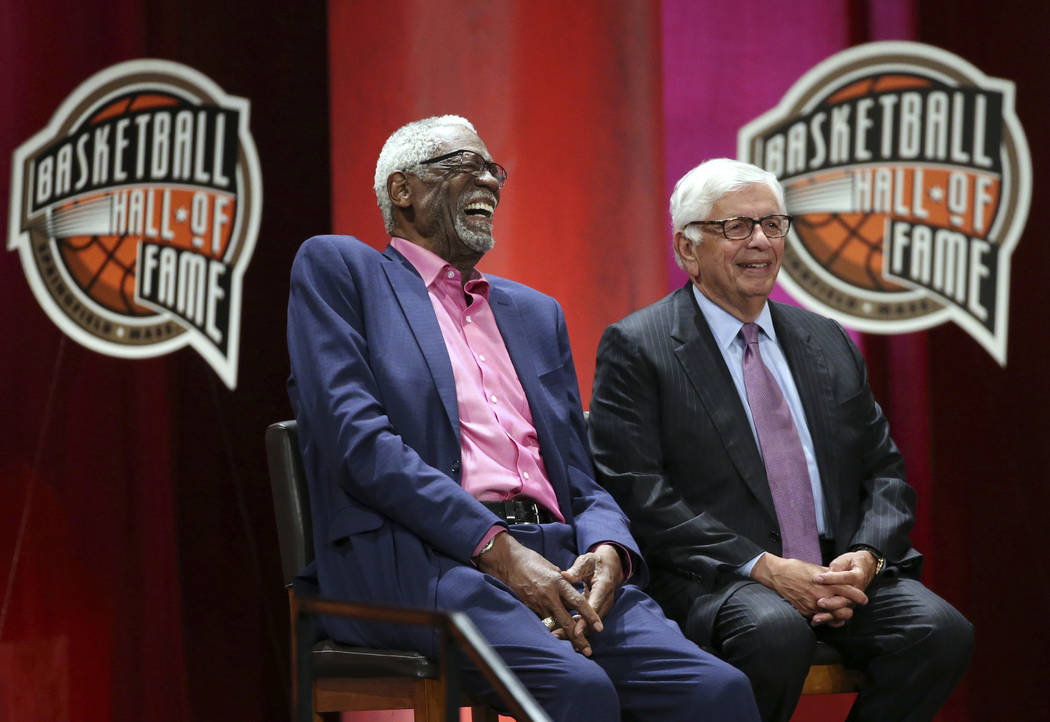 Bill Russell, left, laughs alongside David Stern as they listen to inductee Rick Welts during induction ceremonies into the Basketball Hall of Fame, Friday, Sept. 7, 2018, in Springfield, Mass. (A ...