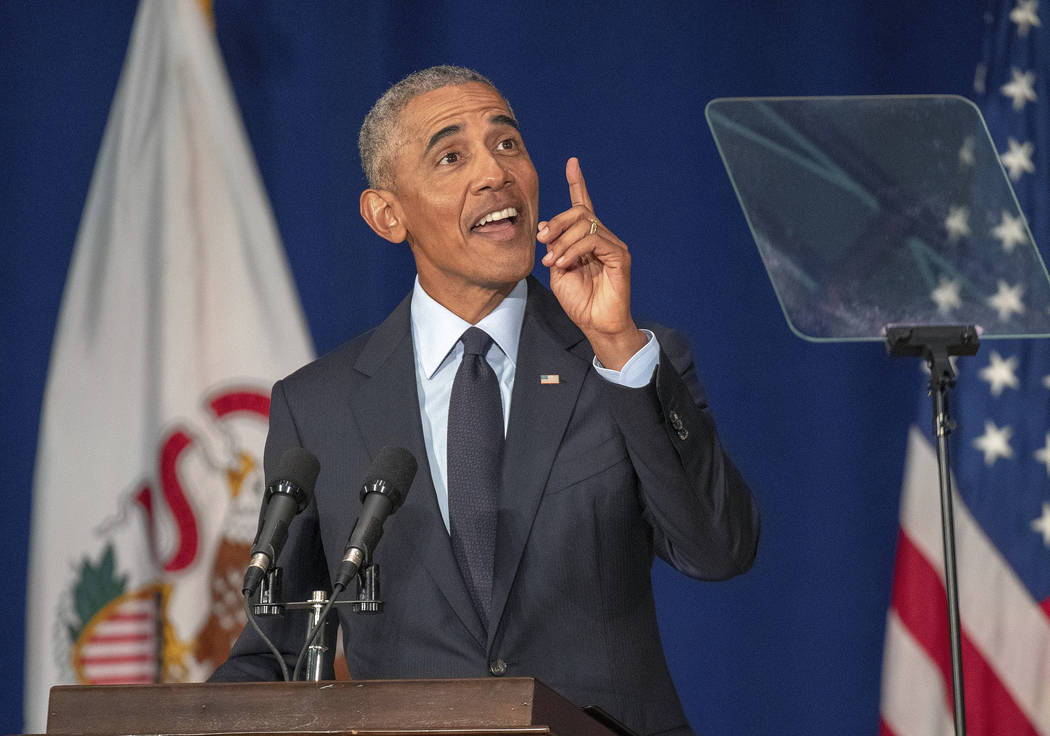 Former President Barack Obama speaks in Foellinger Auditorium on the University of Illinois campus in Urbana, Ill., on Friday, Sept. 7, 2018. Obama will receive a medal for the Paul H. Douglas Awa ...
