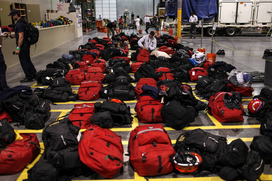 Eric Henderson of Nevada Task Force 1, top right, packs his bags before deployment to Georgia in the wake of Hurricane Irma at their headquarters in Las Vegas, Thursday, Sept. 7, 2017. Joel Angel ...
