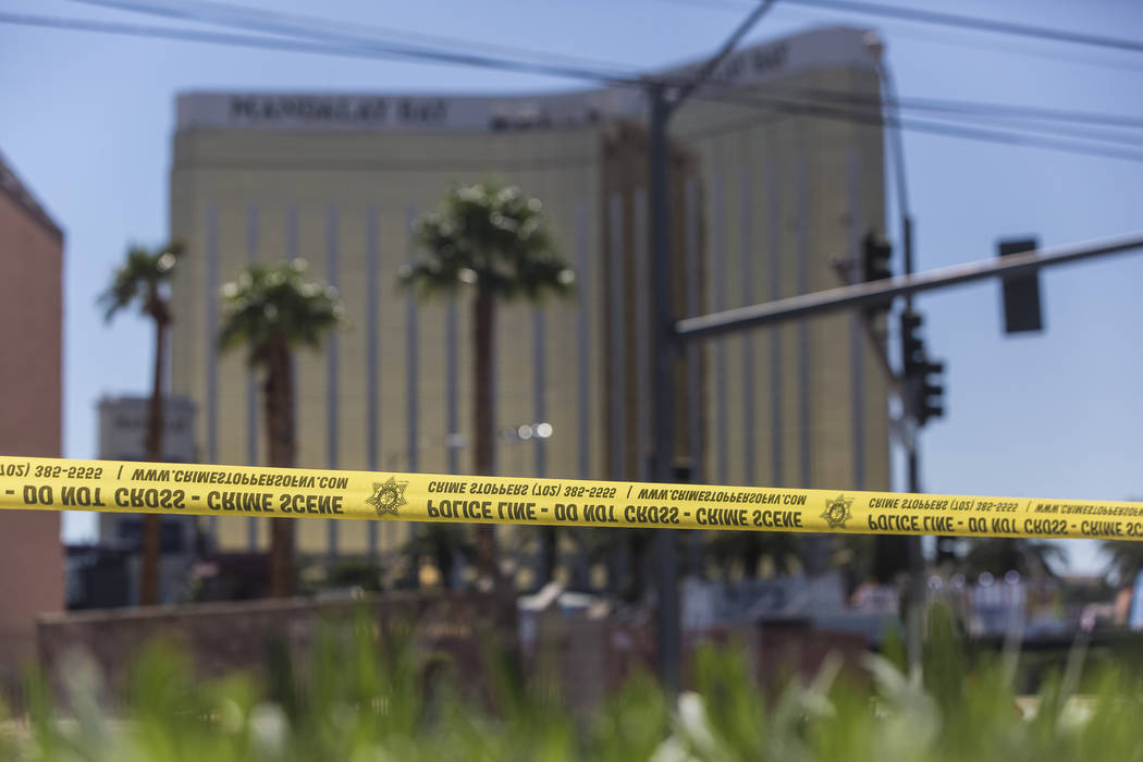 Police tape blocks a section of West Reno Avenue and Las Vegas Boulevard on Monday, October 2, 2017, outside the Mandalay Bay hotel casino, in Las Vegas. Benjamin Hager Las Vegas Review-Journal @b ...
