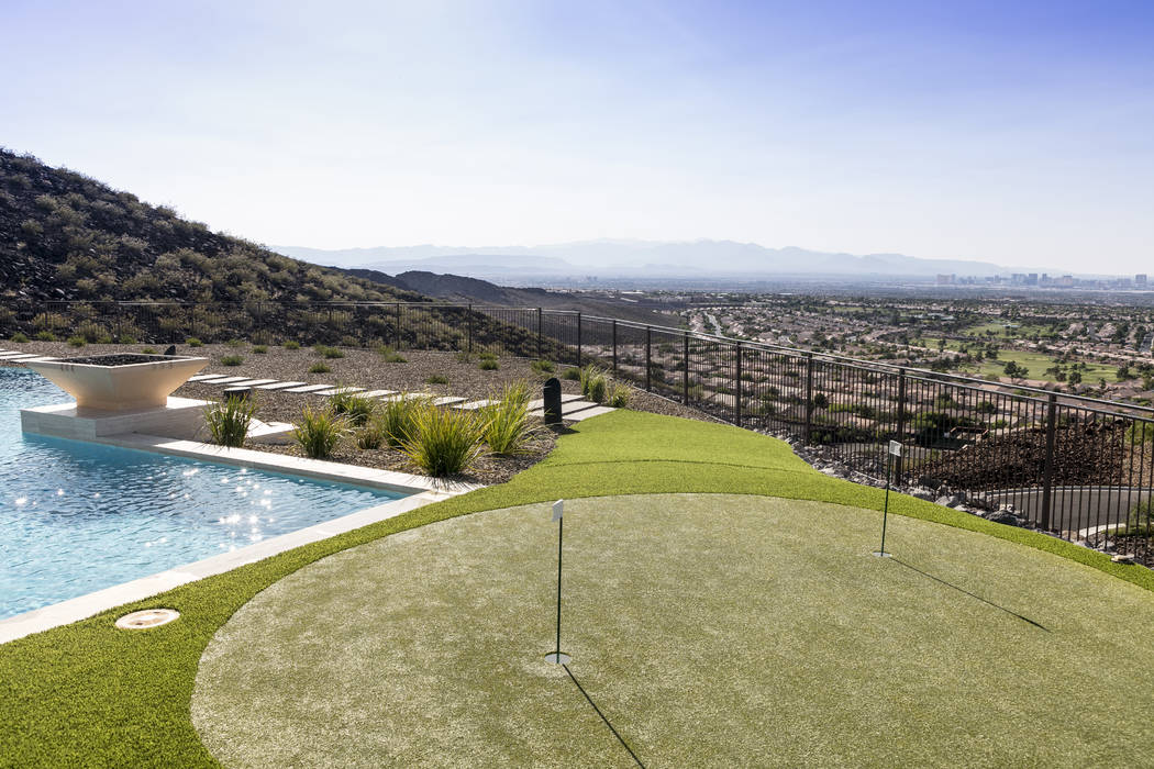 There is a putting green by the pool. (Sun West Custom Homes)