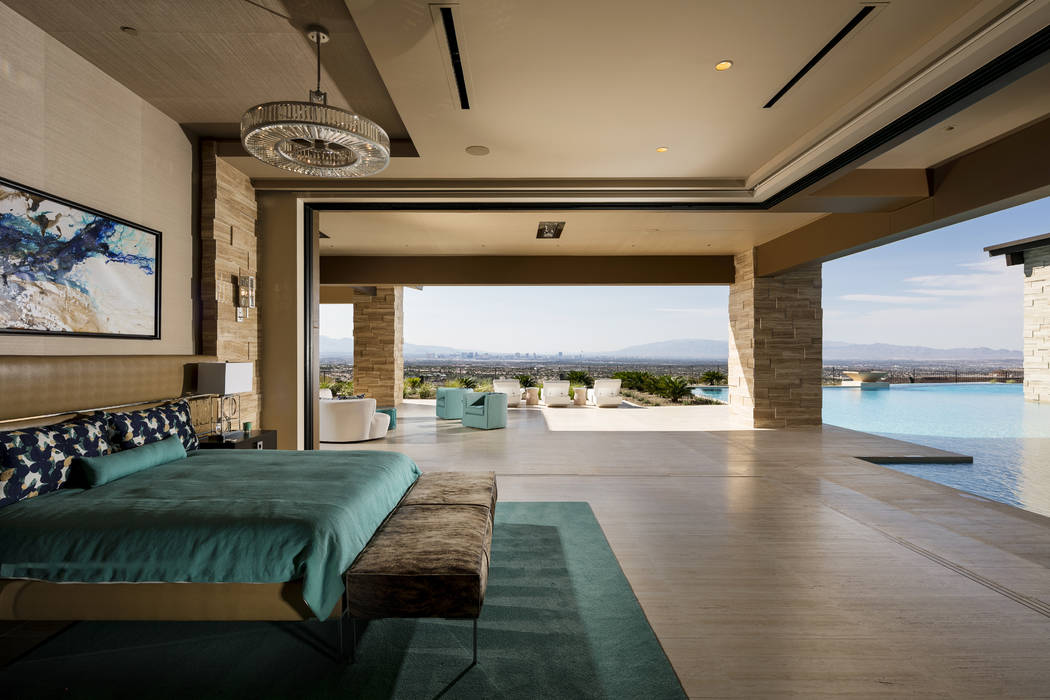 The master bedroom opens to the pool in this $15.5 million Ascaya mansion. (Shay Velich)