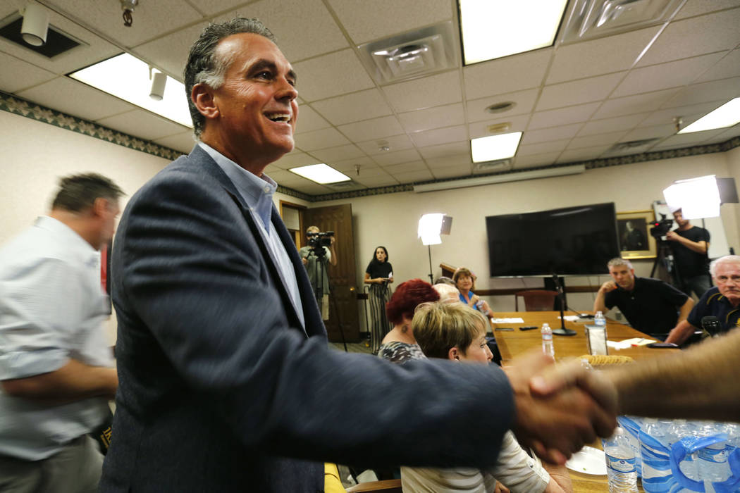 Danny Tarkanian, Republican candidate for the 3rd Congressional District, shakes hands with a panelist as he arrives for the Las Vegas Review-Journal Reader Panel at the RJ in Las Vegas, Wednesday ...