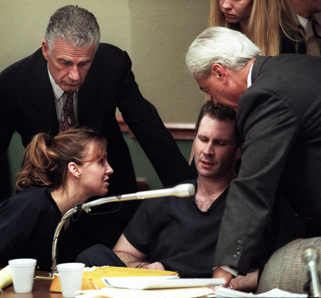 Sandy Murphy and attorneys John Momot, left, and Bill Terry console Rick Tabish during a break in the Ted Binion murder trial in 2000. (File Photo)