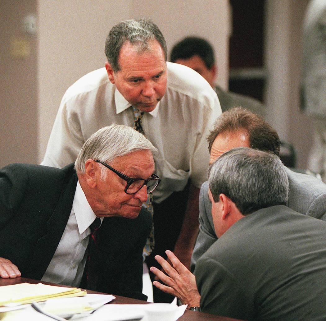 Ted Binion and his attorneys gather around to discuss strategy during a Nevada Gaming Commission hearing in April 1996. (File Photo)