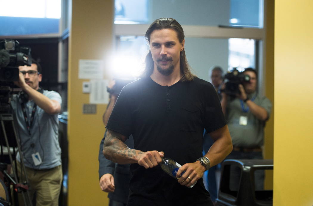 Erik Karlsson arrives to talk to media on the Ottawa Senators first day of NHL hockey training camp in Ottawa on Thursday, Sept. 13, 2018, after he was traded by the team to the San Jose Sharks. ( ...