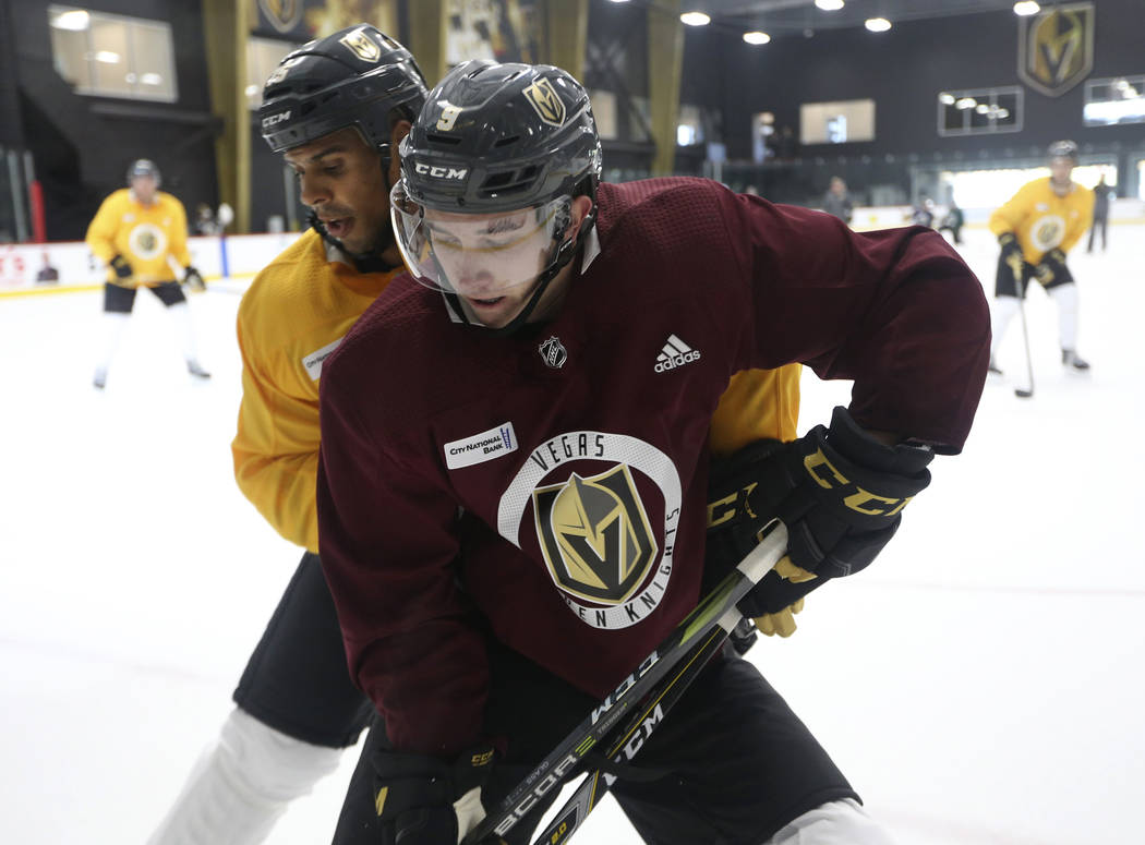 Vegas Golden Knights center Cody Glass (8), foreground, and right wing Ryan Reaves take part in a scrimmage during practice at City National Arena in Las Vegas, Friday, Sept. 14, 2018. Richard Bri ...