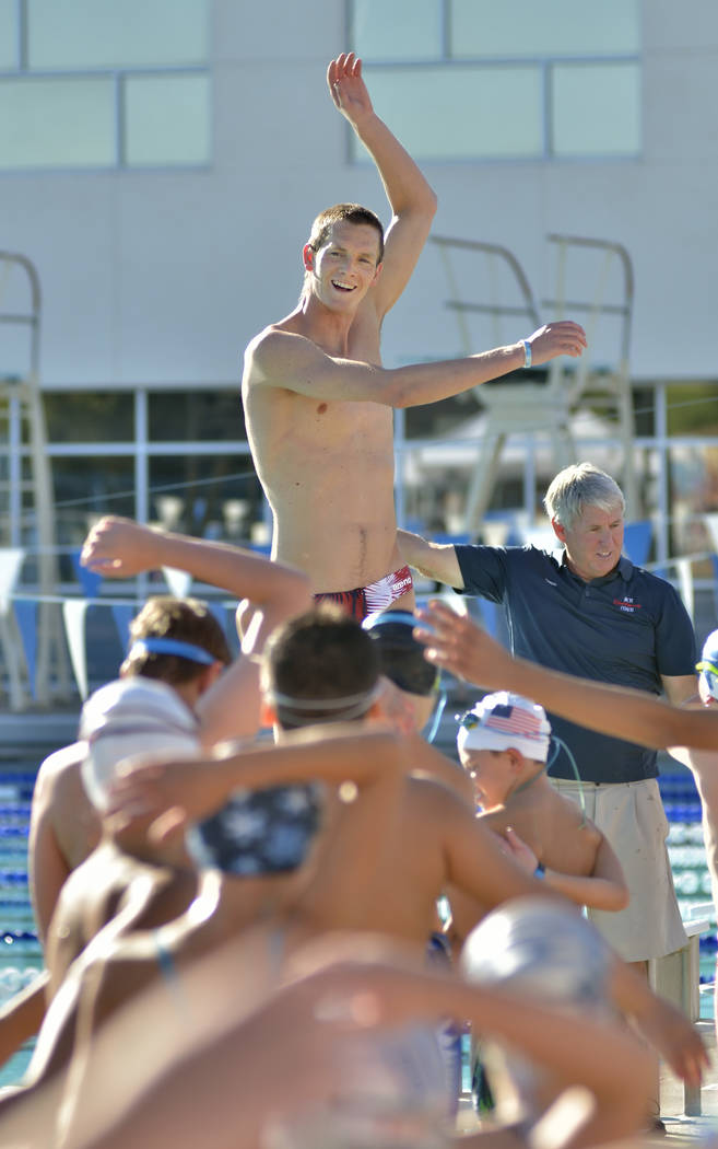 Zane Grothe leads a group of youngsters in stretches while conducting a swimming clinic for members of the Boulder City Henderson Swim Team at the Henderson Multigenerational Center at 250 S. Gree ...