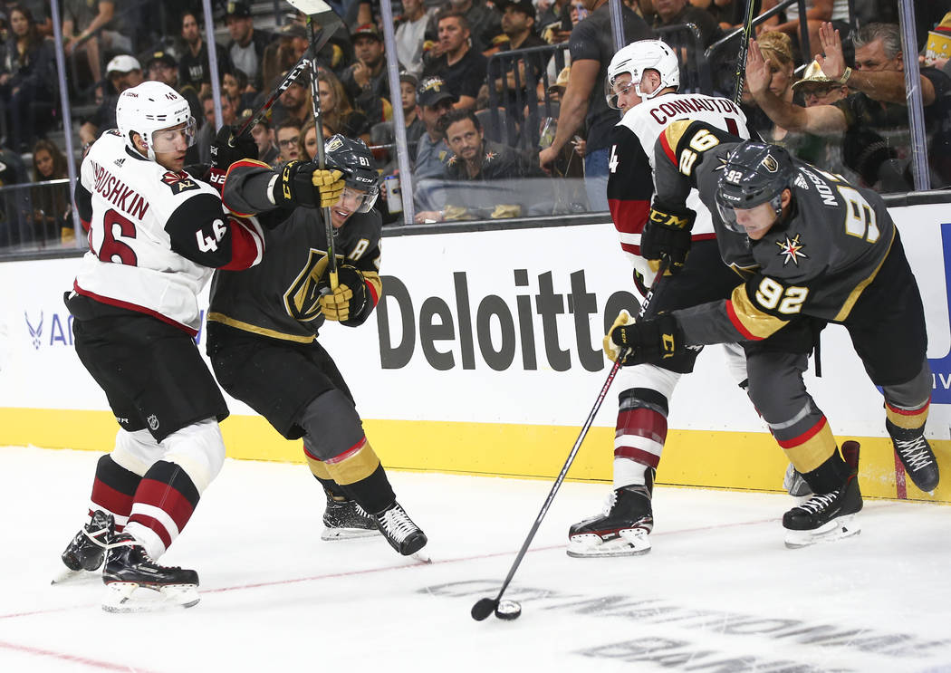 Golden Knights left wing Tomas Nosek (92) gets the puck past Arizona Coyotes defenseman Kevin Connauton (44) in front of Arizona Coyotes defenseman Ilya Lyubushkin (46) and Golden Knights center J ...