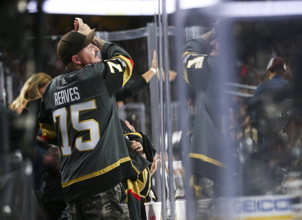 Golden Knights fans celebrate a goal by Golden Knights center Jonathan Marchessault, not pictured, during the second period of a preseason NHL hockey game against the Arizona Coyotes at T-Mobile A ...