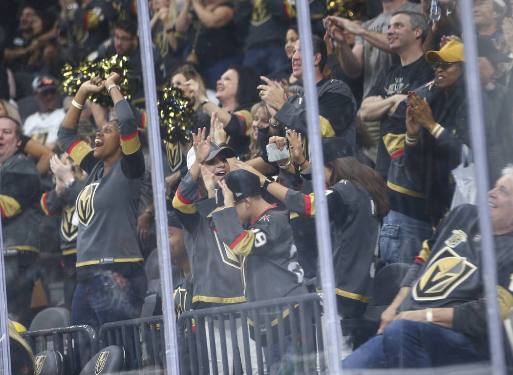 Golden Knights fans celebrate a goal by Golden Knights defenseman Nicolas Hague, not pictured, during the second period of a preseason NHL hockey game at T-Mobile Arena in Las Vegas on Sunday, Sep ...