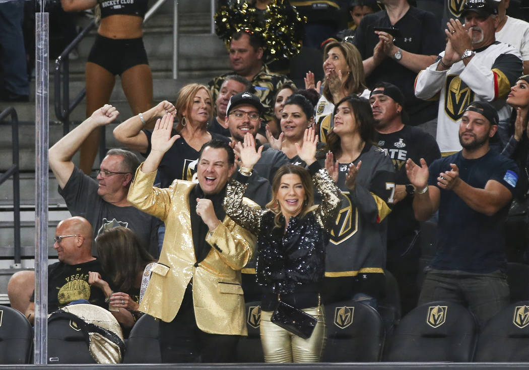 Golden Knights fans celebrate a goal by Golden Knights left wing Max Pacioretty (67) during the first period of a preseason NHL hockey game against the Arizona Coyotes at T-Mobile Arena in Las Veg ...