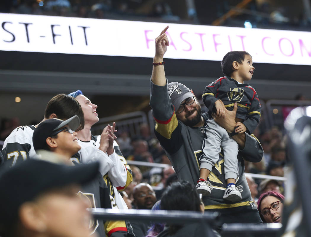 Golden Knights fans cheer during a break in the third period of a preseason NHL hockey game against the Arizona Coyotes at T-Mobile Arena in Las Vegas on Sunday, Sept. 16, 2018. Chase Stevens Las ...