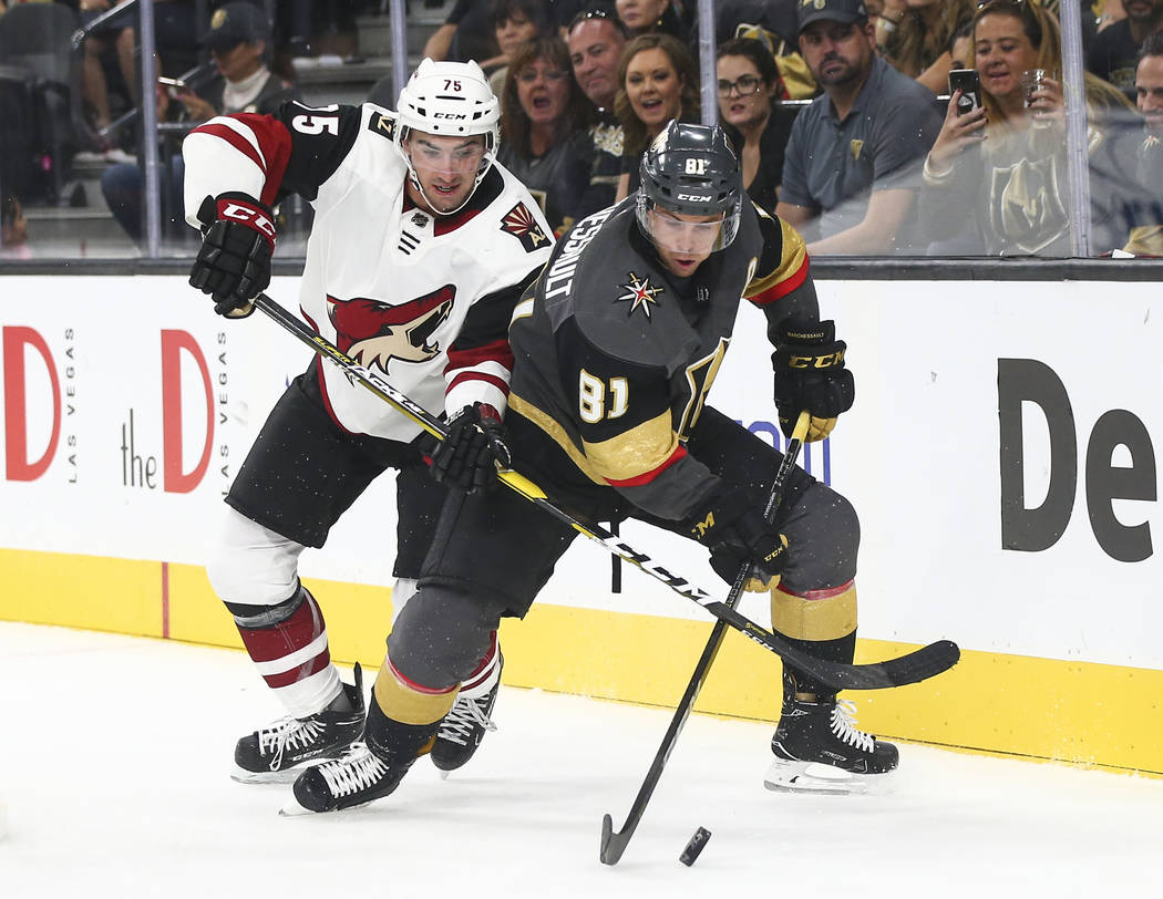 Golden Knights center Jonathan Marchessault (81) moves the puck in front of Arizona Coyotes Kyle Capobianco (75) during the third period of a preseason NHL hockey game at T-Mobile Arena in Las Veg ...