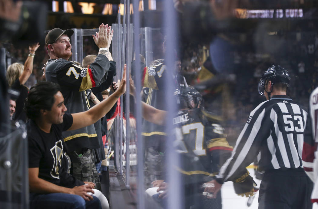 Golden Knights fans cheer at the conclusion of a preseason NHL hockey game against the Arizona Coyotes at T-Mobile Arena in Las Vegas on Sunday, Sept. 16, 2018. Chase Stevens Las Vegas Review-Jour ...
