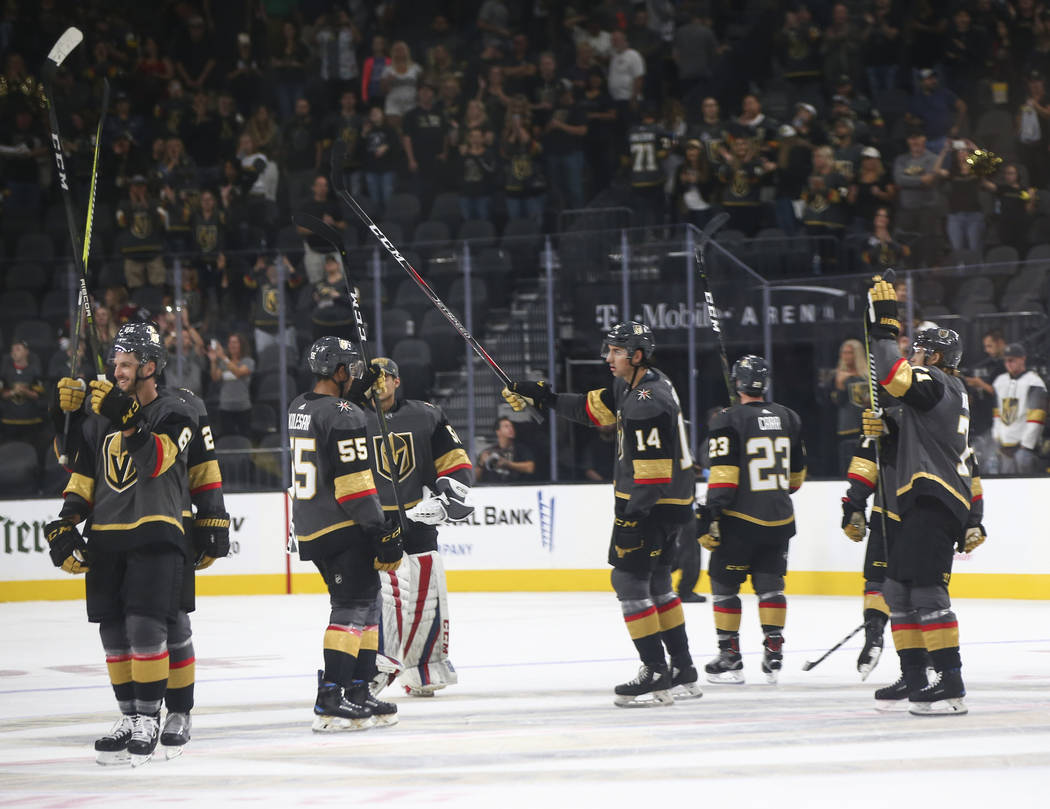Golden Knights players celebrate at the conclusion of a preseason NHL hockey game against the Arizona Coyotes at T-Mobile Arena in Las Vegas on Sunday, Sept. 16, 2018. Chase Stevens Las Vegas Revi ...