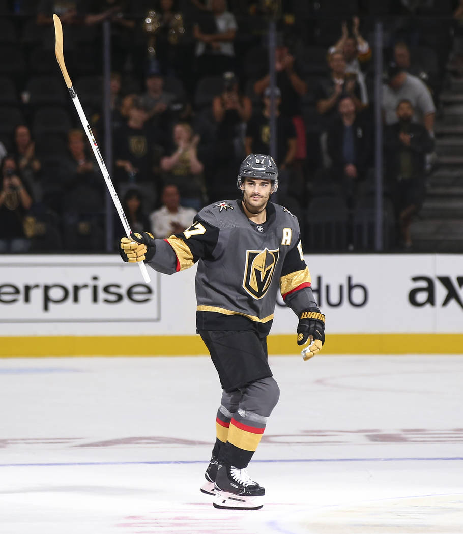 Golden Knights left wing Max Pacioretty (67) looks for a young fan to pass along a hockey stick after a preseason NHL hockey game against the Arizona Coyotes at T-Mobile Arena in Las Vegas on Sund ...