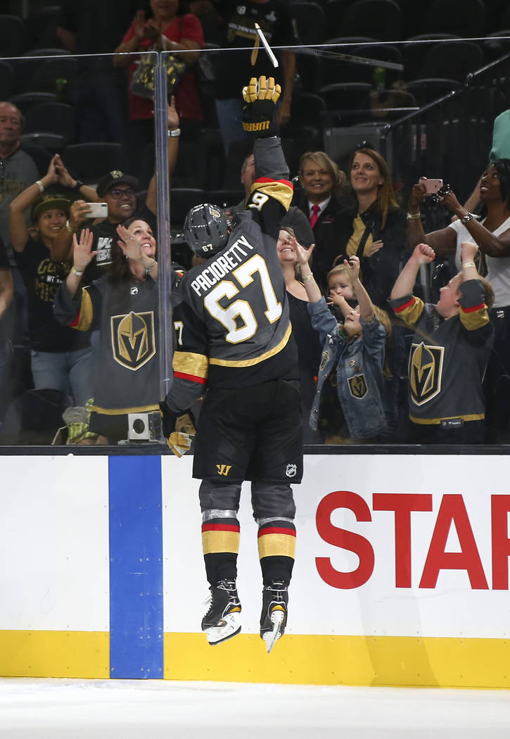Golden Knights left wing Max Pacioretty (67) passes along a hockey stick to a young fan after a preseason NHL hockey game against the Arizona Coyotes at T-Mobile Arena in Las Vegas on Sunday, Sept ...