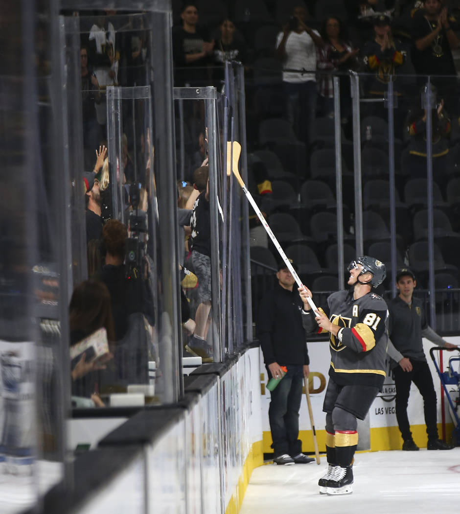 Golden Knights center Jonathan Marchessault (81) passes along a hockey stick to a young fan after a preseason NHL hockey game against the Arizona Coyotes at T-Mobile Arena in Las Vegas on Sunday, ...