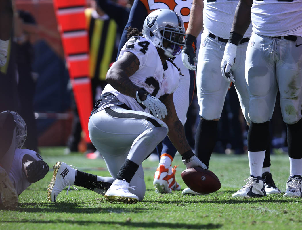 Oakland Raiders running back Marshawn Lynch (24) gets up after being tackled during the first half of their NFL game against the Denver Broncos in Denver, Colo., Sunday, Sept. 16, 2018. Heidi Fang ...
