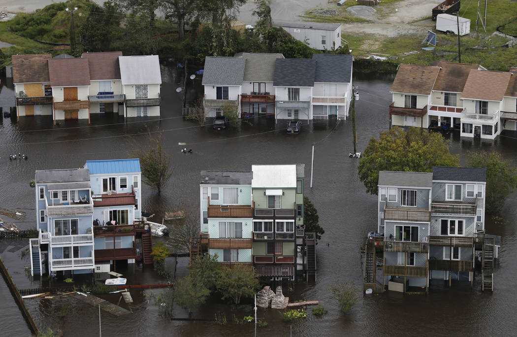 Homes along the New River are flooded as a result of high tides and rain from hurricane Florence which moved through the area in Jacksonville, N.C., Sunday, Sept. 16, 2018. (Steve Helber/AP)