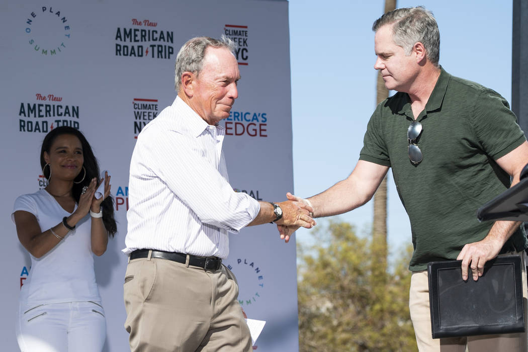 Former New York City mayor Michael Bloomberg and MGM Resorts International CEO James Murren shake hands in front of the Luxor casino-hotel in Las Vegas during "The New American Road Trip,&quo ...