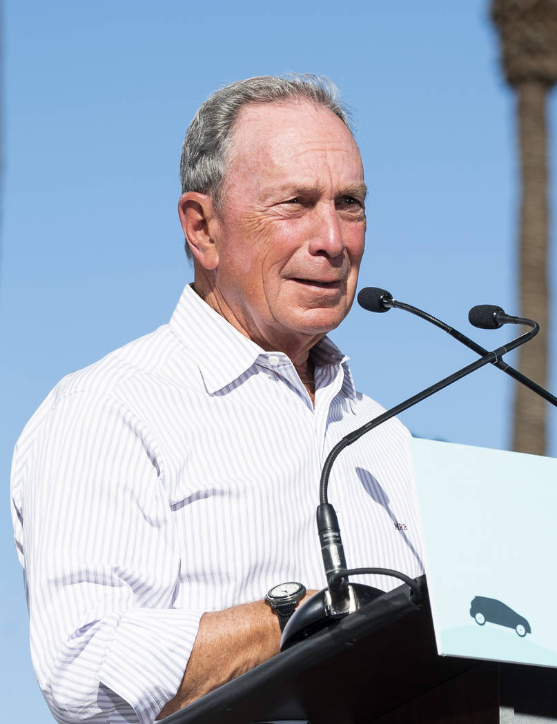 Former New York City mayor Michael Bloomberg speaks in front of the Luxor hotel-casino in Las Vegas at an event for "The New American Road Trip," an electric-vehicle tour from California ...