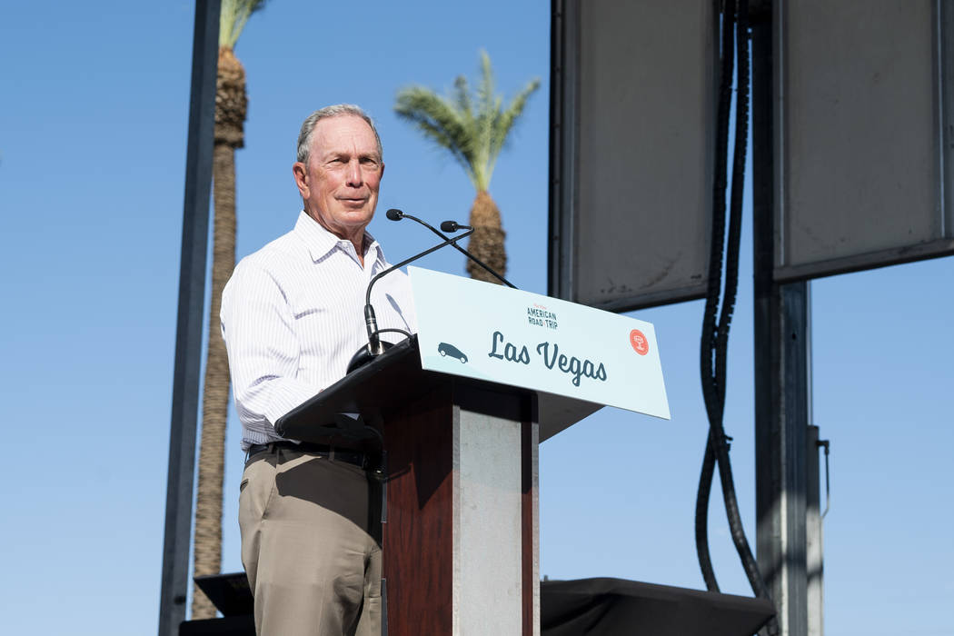 Former New York City mayor Michael Bloomberg speaks in front of the Luxor hotel-casino in Las Vegas at an event for "The New American Road Trip," an electric-vehicle tour from California ...