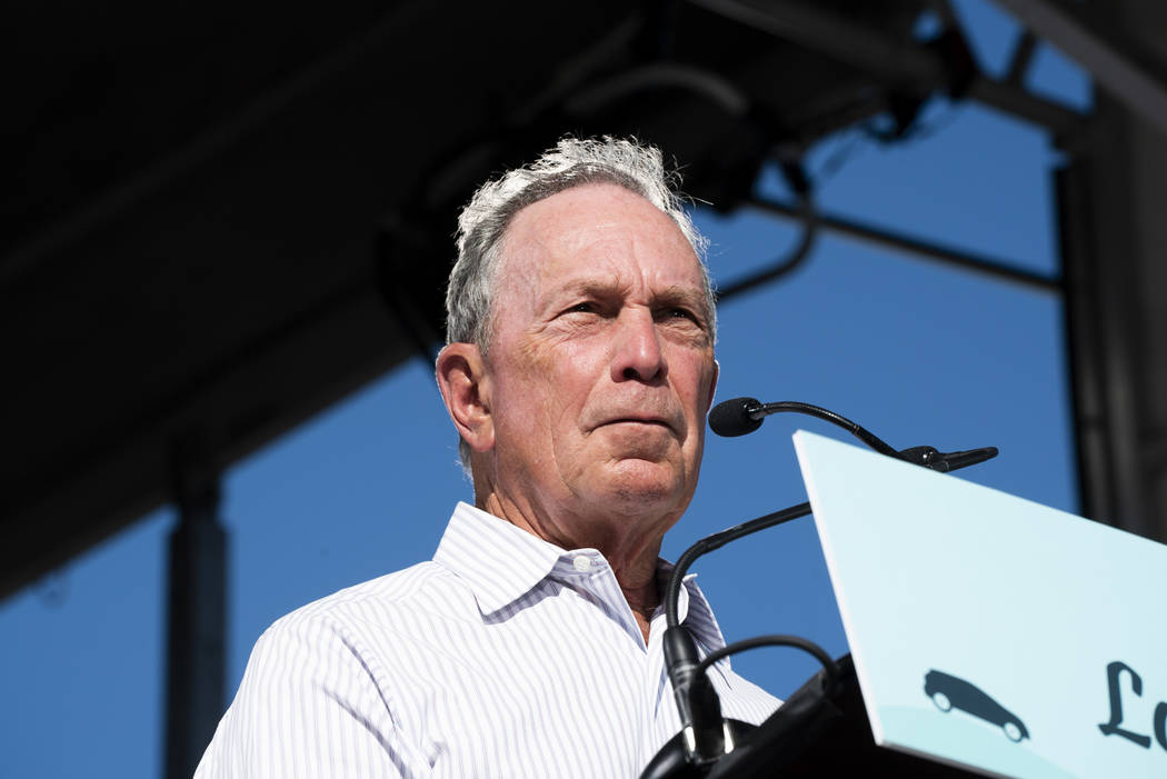 Former New York City mayor Michael Bloomberg speaks in front of the Luxor hotel-casino in Las Vegas at an event for "The New American Road Trip," an electric-vehicle tour from Californi ...