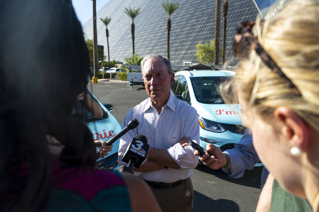 Former New York City mayor Michael Bloomberg speaks with media in front of the Luxor hotel-casino in Las Vegas at "The New American Road Trip," an electric-vehicle tour from California t ...
