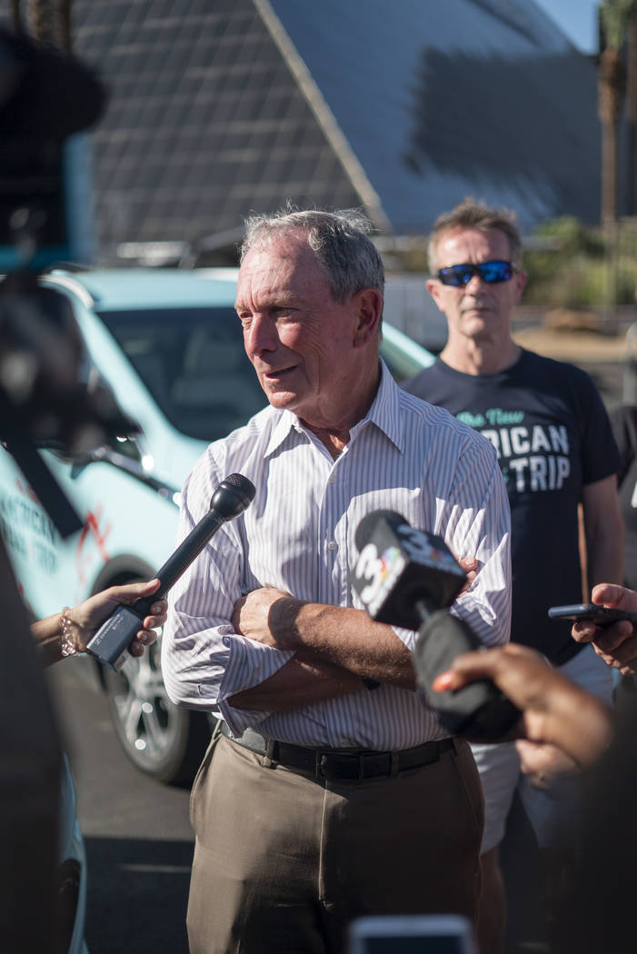 Former New York City mayor Michael Bloomberg speaks with media in front of the Luxor hotel-casino in Las Vegas at "The New American Road Trip," an electric-vehicle tour from California t ...