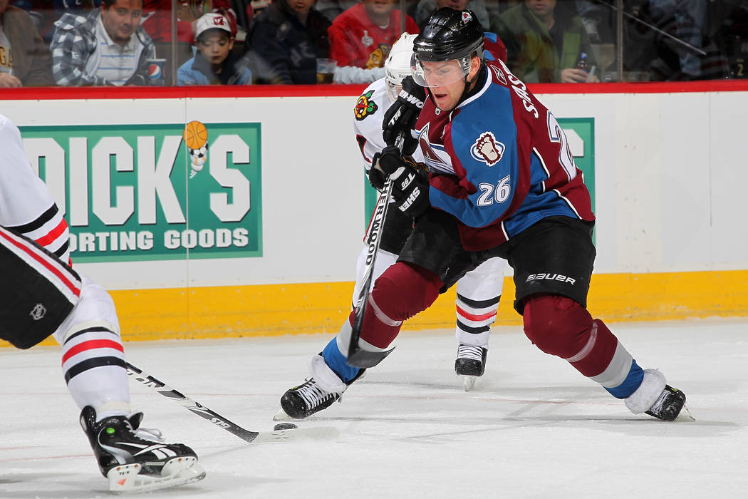 DENVER, CO - DECEMBER 13: Paul Stastny #26 of the Colorado Avalanche skates the puck through the Chicago Blackhawk defense at the Pepsi Center on December 13, 2010 in Denver, Colorado. (Photo by ...