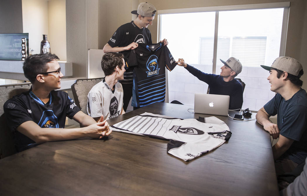 Rogue team members Brian Thomas, left, Colin Wentworth, Sean Mulryan, Andrew Stickney, Derek Nelson and Sean Mulryan take a look at the Las Vegas-based eSports team's newest jersey during a meetin ...