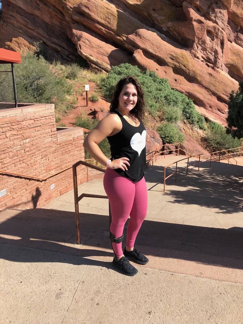 Rylie Golgart, 19, poses in Colorado near the Craig Hospital rehabilitation facility where she was treated for two months after taking a bullet to the spine in the Oct. 1 shooting on the Las Vegas ...