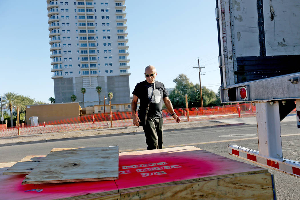 Artist Bobby Jacobs oversees the moving of his stone sculpture to the Healing Garden in Las Vegas, Thursday, Sept. 20, 2018. The back of the wings have the initials of each of the Oct. 1 victims. ...