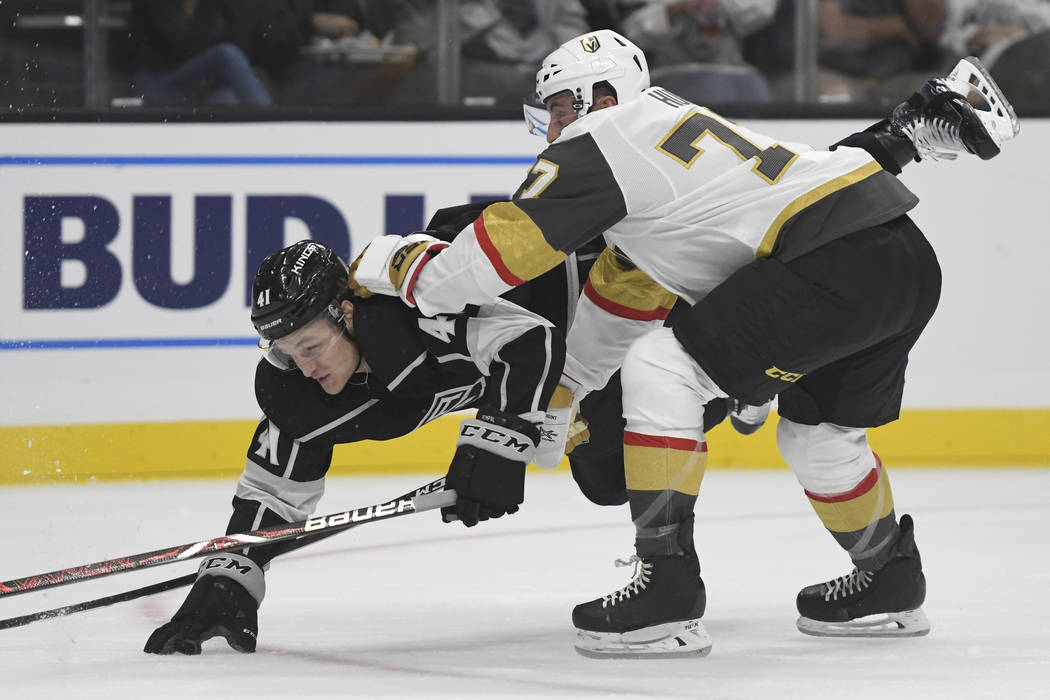 Vegas Golden Knights defenseman Brad Hunt (77) checks Los Angeles Kings right wing Sheldon Rempal (41) during the first period of a preseason NHL hockey game, Thursday, Sept. 20, 2018, in Los Ange ...