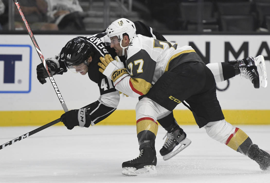 Vegas Golden Knights defenseman Brad Hunt (77) checks Los Angeles Kings right wing Sheldon Rempal (41) during the first period of a preseason NHL hockey game Thursday, Sept. 20, 2018, in Los Angel ...