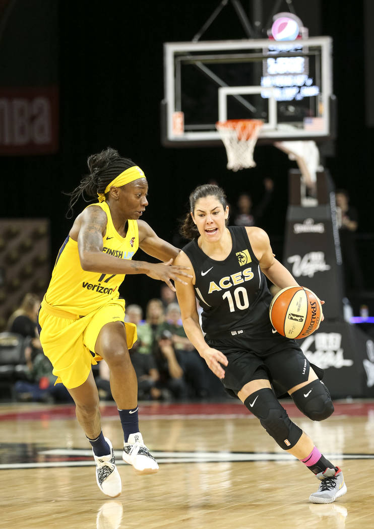 Las Vegas Aces guard Kelsey Plum (10) drives the ball past Indiana Fever guard Erica Wheeler (17) during the first half of a WNBA basketball game at the Mandalay Bay Events Center on Saturday, Aug ...