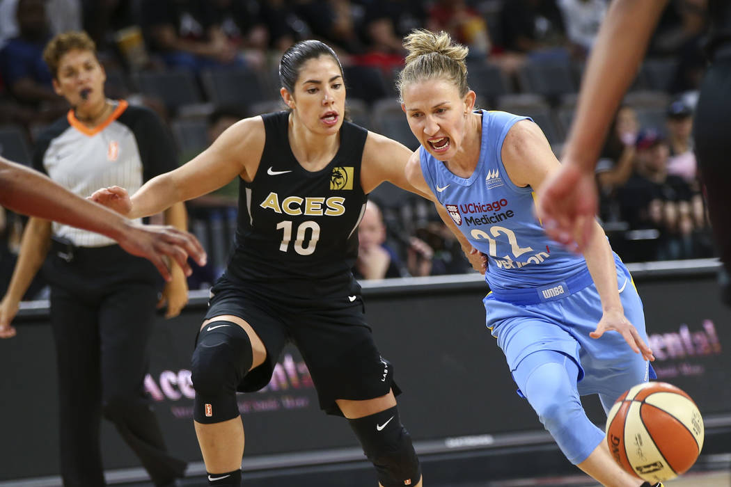 Chicago Sky guard Courtney Vandersloot (22) drives the ball past Las Vegas Aces guard Kelsey Plum (10) during the first half of a WNBA basketball game at Mandalay Bay Events Center in Las Vegas on ...