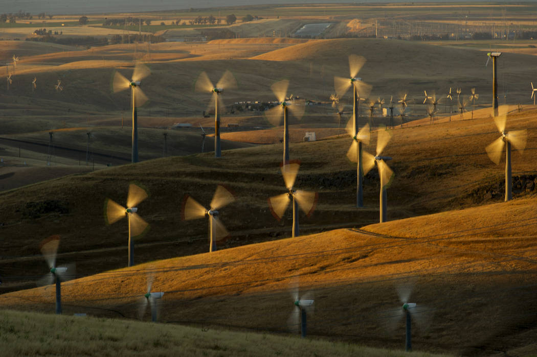 Wind turbines lining the Altamont Pass near Livermore, Calif., generate electricity on May 12, 2013. A California legislative panel is debating a proposal to move up the state's target for using 5 ...