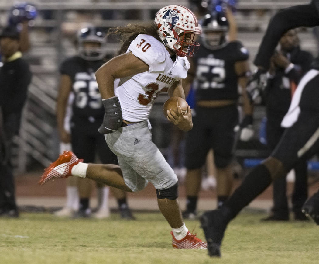 Liberty sophomore running back Zyrus Fiaseu (30) sprints up field in the first quarter during the Patriots road game with the Desert Pines Jaguars on Friday, Sept. 21, 2018, at Desert Pines High S ...