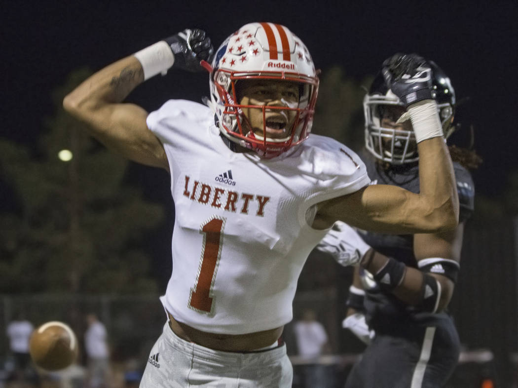 Liberty senior wide receiver Cervontes White (1) flexes after getting a pass interference call in his favor in the second quarter during the Patriots road game with the Desert Pines Jaguars on Fri ...